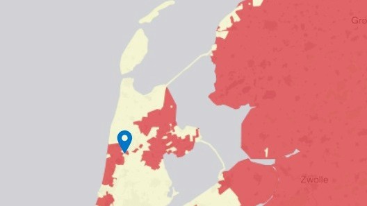Kaart van Nederland met een blauwe markering in de buurt van de Randstad en diverse regio's in rood weergegeven.