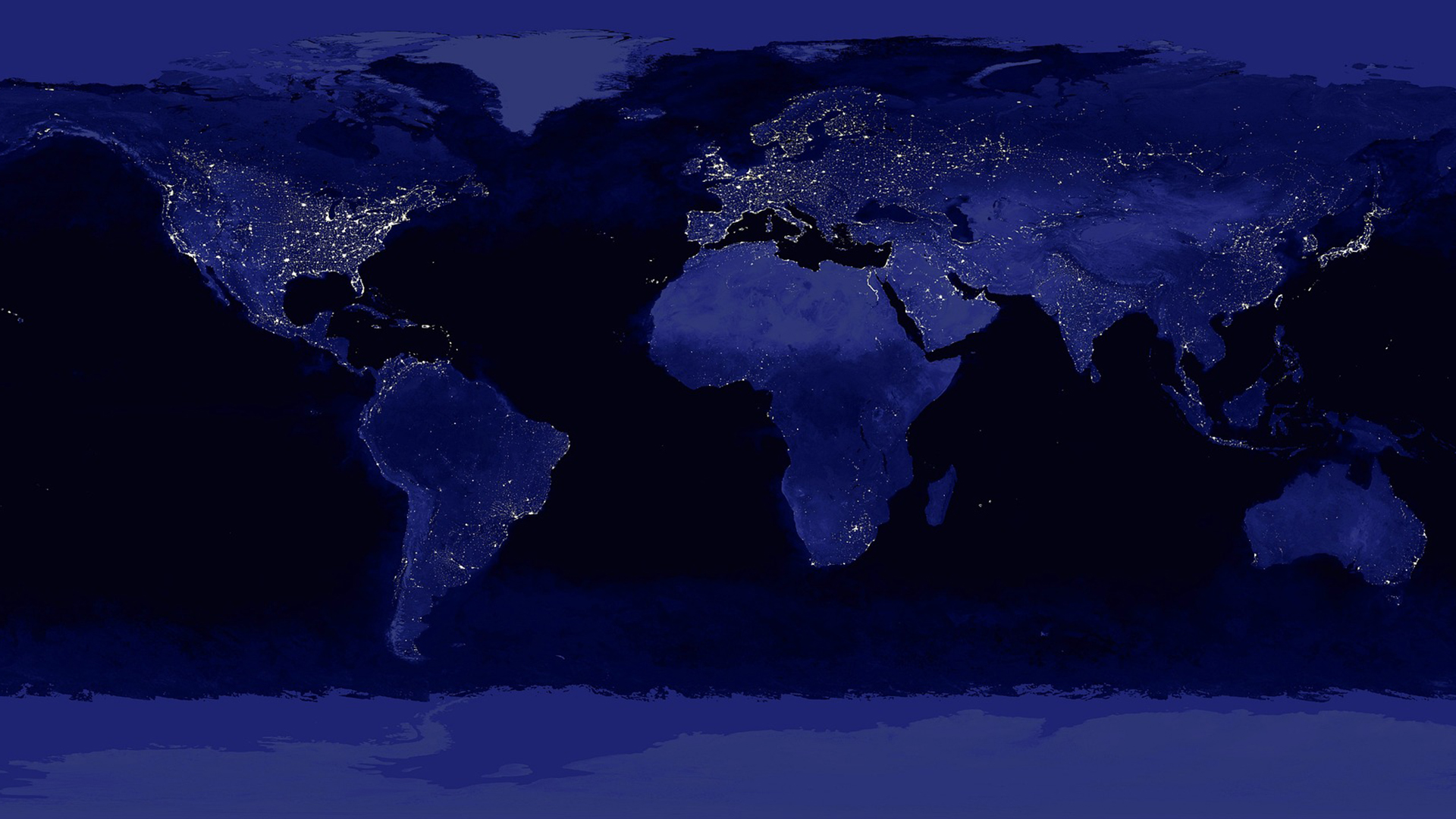 Wereldkaart van de aarde bij nacht, met heldere stadslichten zichtbaar in Noord-Amerika, Europa en Azië